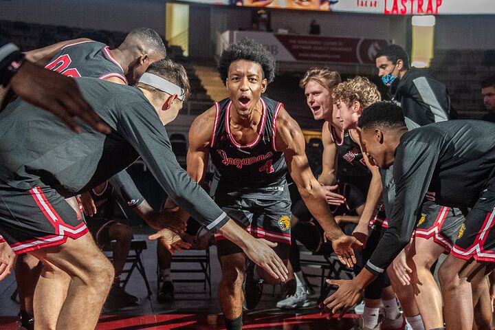 Members of the IU Indianapolis men's basketball team are introduced before a game.
